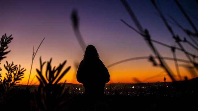 Silhouette of a woman looking at city lights, Stellenbosch, Western Script, South Africa