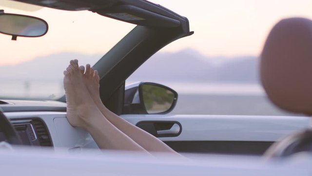 Woman Relaxing in Convertible Car