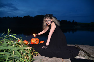 Witch with tousled hair during the ritual, for Halloween. Design concept for an article about Halloween.