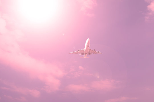 Plane against the sky with the sunset.
