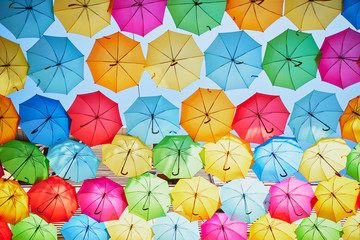 Fototapeta na wymiar street decoration of many colorful umbrellas