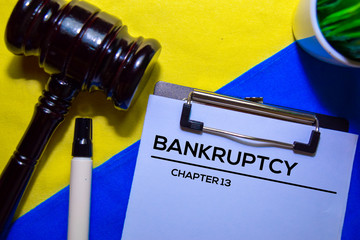 Bankcrupty Chapter 13 text on Document form and Gavel isolated on office desk.