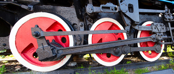   Wheels of an old restored locomotive. Wide, Horizontal.