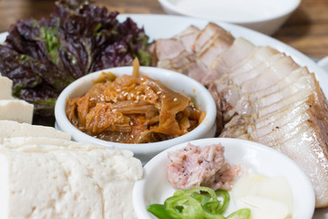 Korean traditional food bossam, boiled pork eaten with bossam kimchi