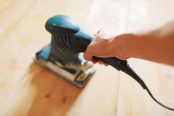 wooden floor sanding with flat sander tool