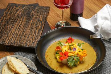 Vegetable curry with mango. Exquisite dish. Creative restaurant meal concept.	