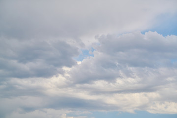 blue sky background with fluffy clouds.
