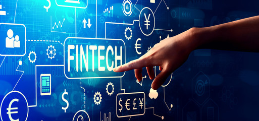 Fintech theme with hand pressing a button on a technology screen