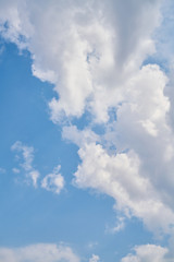 blue sky background with fluffy clouds.