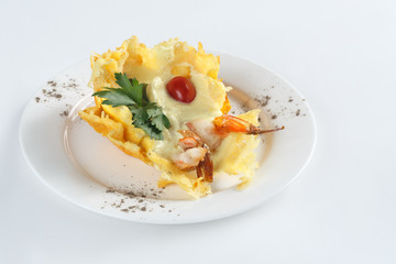 Dish of mashed potatoes, tomatoes and herbs