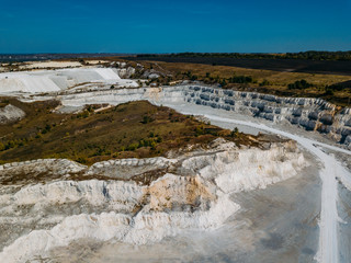 Open chalky quarry, aerial view from drone