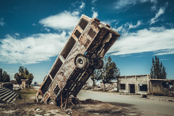 The bus is damaged and rusted in Akesai Oil Town, Jiuquan City, Gansu Province, China