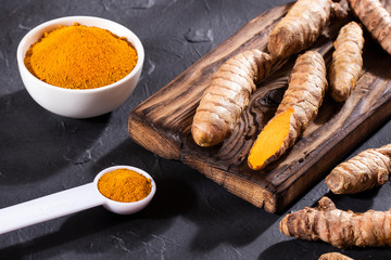 Roots and turmeric powder - Curcuma longa.