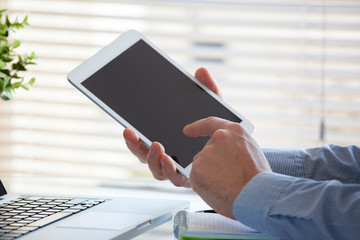 Businessman working on tablet in the office