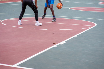 Fototapeta premium Basketball player dribbling ball during match