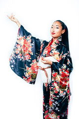 young pretty real geisha in kimono with sakura and decoration on white background isolated