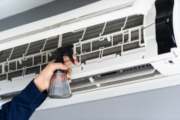 close up technician service cleaning the air conditioner