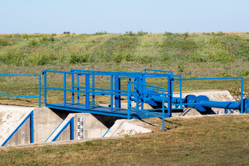 The railing and sluice.