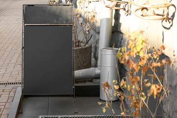 Blank advertising stander on city street