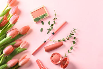 Beautiful tulips with cosmetics on color background