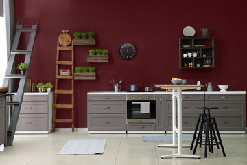 Interior of modern kitchen with stylish furniture