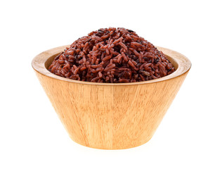 brown rice in wood bowl on white background