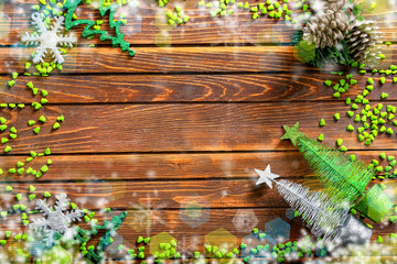 Frame made of Christmas decorations on wooden background
