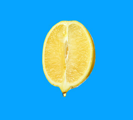 Essential oil dripping from lemon cut on white background