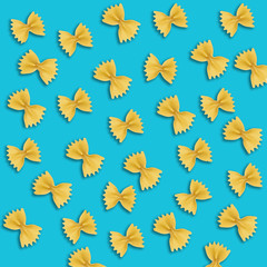 Fototapeta premium Uncooked farfalle pasta on color background