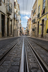 Fototapeta na wymiar Famous street of Lisbon named Rua da Bica with the beatiful view of the horizon