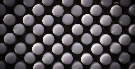 abstract texture of rods with white circle heads texture with vignette. design, background.