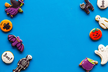 Frame from halloween figures on blue background top view space for text