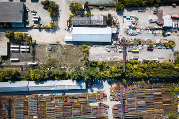 Top view of the industrial zone: garages, warehouses, containers for storing goods. The concept of storage of goods by importers, exporters, wholesalers, transport enterprises, customs