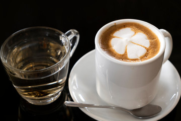 Hot coffee and tea on a black background