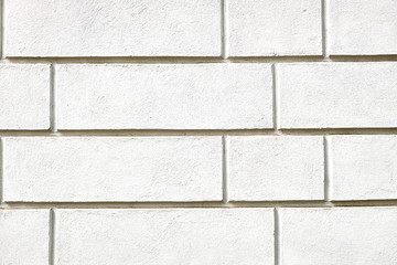 Background from a wall with white stone slabs