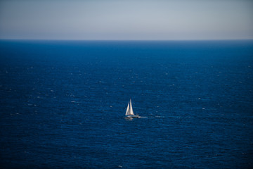 Fototapeta premium Lonely yacht in the Atlantic Ocean off the coast of Brittany. Finister. Brittany. France