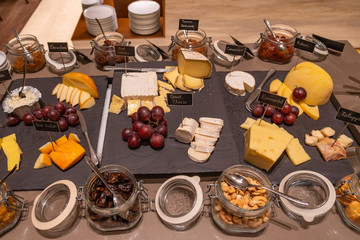 Assortment of cheese and nuts for breakfast at luxury hotel