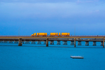 Australian road train crossing a bridge