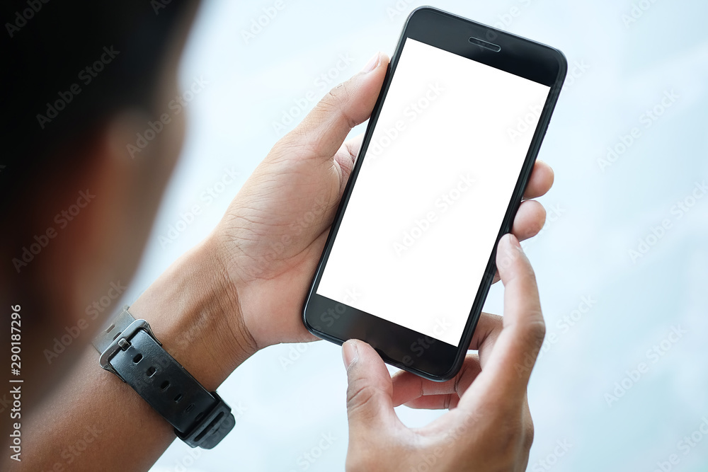 Poster cropped shot view of man hands holding smart phone with blank copy space screen for your text messag