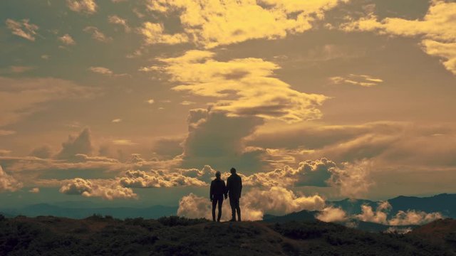 The flight above a man and woman on the mountain top