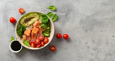 Fototapeta na wymiar Healthy vegan food concept Poke bowl with salmon, avocado, vegetables and chia seeds