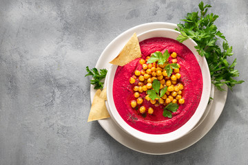 Healthy Diet Food Concept Beetroot hummus in plate with pita bread light background
