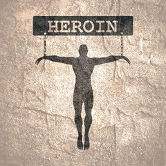 Fototapeta na wymiar Man chained to heroin word. Unhealthy addiction metaphor.