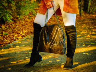 Woman wearing orange autumn cardigan outdoor