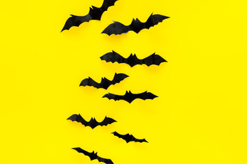 Fototapeta premium Halloween design. Bats on yellow background top view space for text