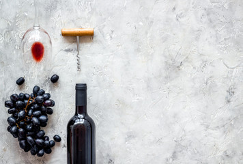 Composition with wine bottle on grey background top view copy space