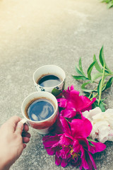 Two cup coffee and peony flowers