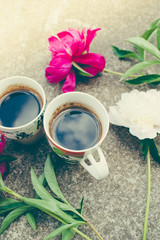 Two cup coffee and peony flowers