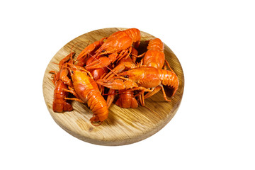 Boiled crayfish on wooden cutting board isolated on white background