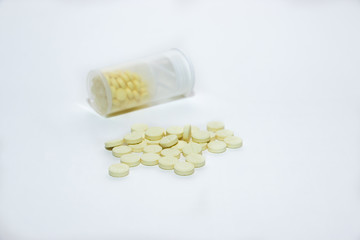 Prevention of colds. Pills for the treatment of the disease in plastic packaging on a white background. Flat lay on a medical theme.